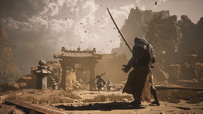 The Destined One runs towards Tiger's Acolyte, who stands on a bridge surrounded by sandstorms in Black Myth: Wukong.