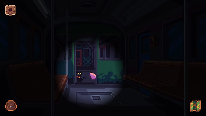 Exploring a dark train car in Devil's Hideout. A cat is visible in a flashlight's glow.