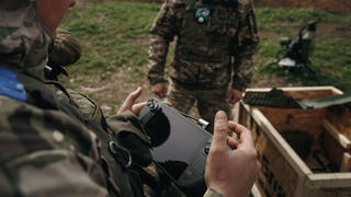 A Steam Deck being used to control a machine gun turret